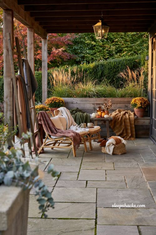Fall patio decor with cozy weatherproof throw blankets and outdoor seating