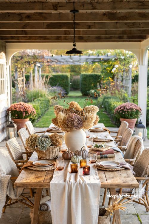 Fall patio decor with dried hydrangea centerpiece and cozy outdoor styling