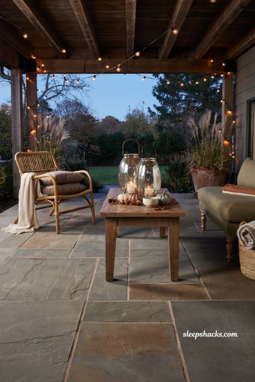 Fall patio decor with mercury glass lantern and cozy autumn candlelight