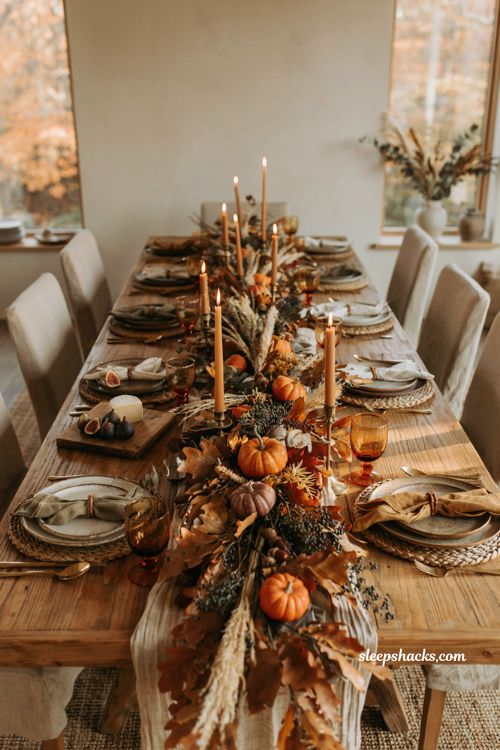 Fall table decor ideas with lush autumn garland and candle centerpiece