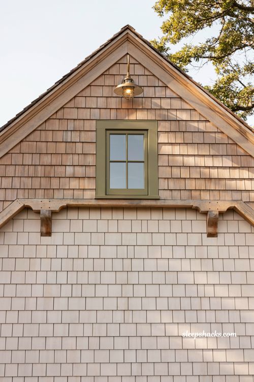 Farmhouse exterior siding ideas pairing white horizontal lap siding with a natural cedar shingle gable peak