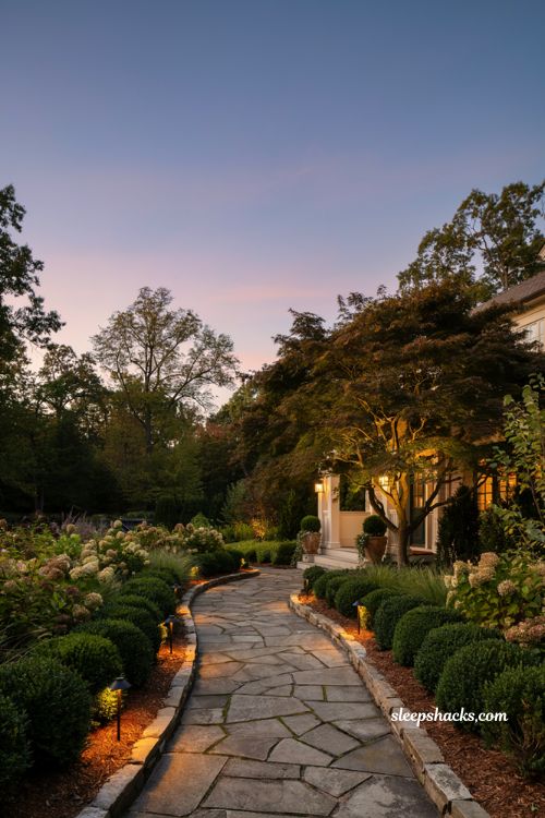 Front lawn landscaping ideas with path lights and garden bed landscape lighting