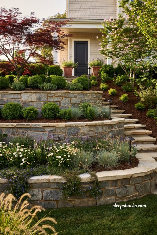 Front lawn landscaping ideas with terraced garden and natural stone retaining walls