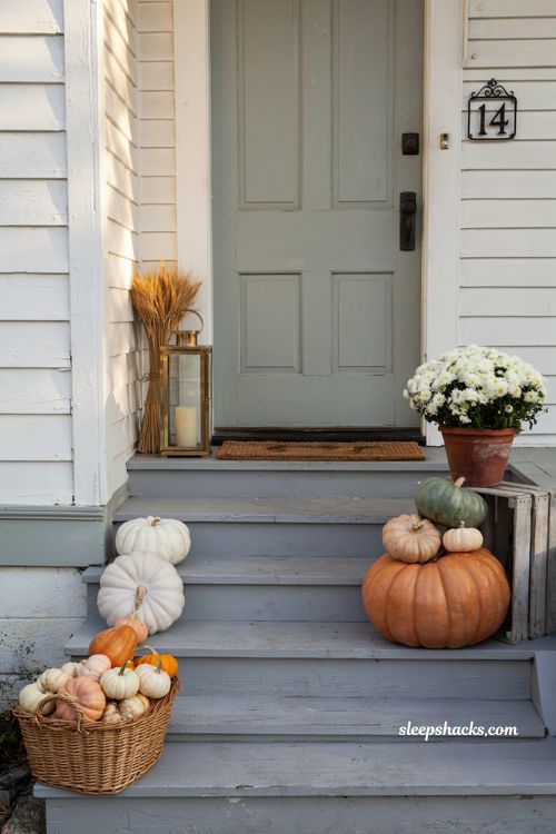Front porch pumpkins display ideas for a small cozy fall entry