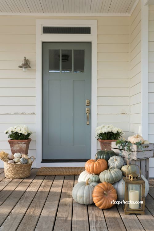 Front porch pumpkins display ideas with a neutral white and sage pumpkin palette