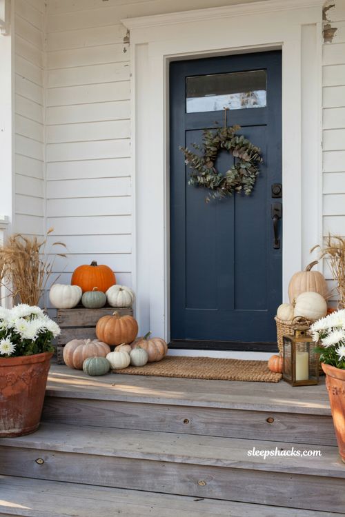 Front porch pumpkins display ideas with naturally styled odd number groupings