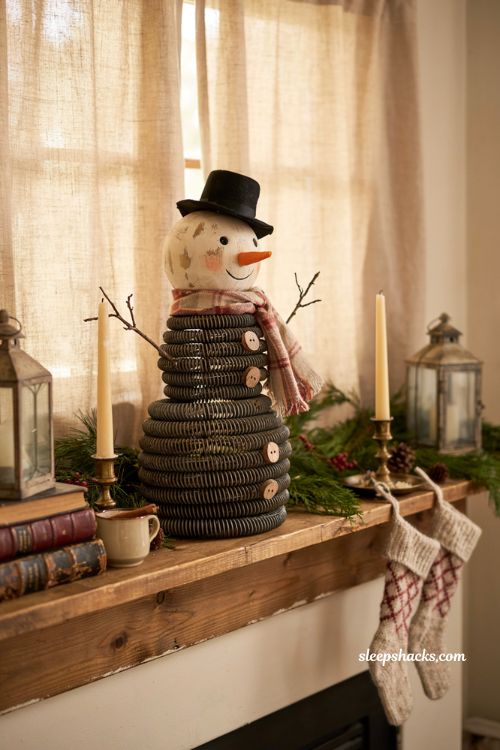Handmade bedspring snowman decoration with rustic upcycled christmas mantel decor