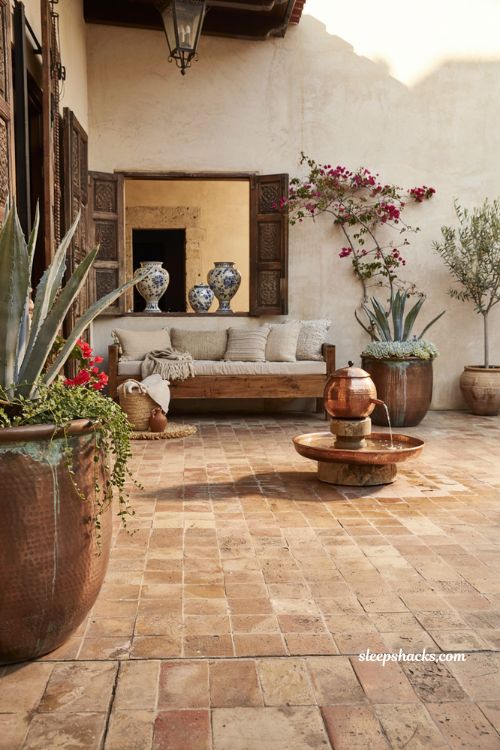 Mexican patio blueprint with copper planters and handcrafted courtyard water fountain