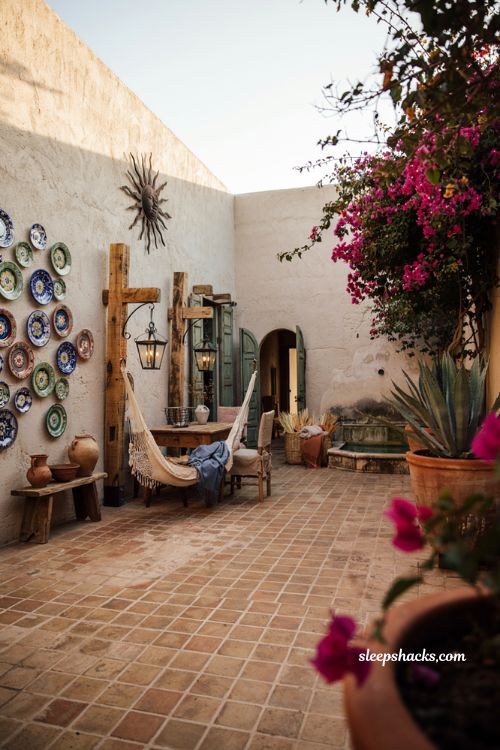Mexican patio blueprint with handcrafted ceramic decor and wrought iron wall art
