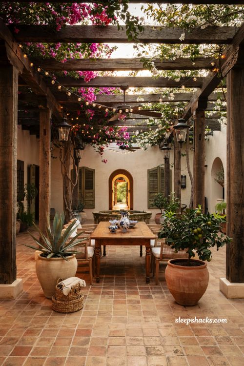 Mexican patio blueprint with wooden pergola climbing vines and rustic courtyard dining