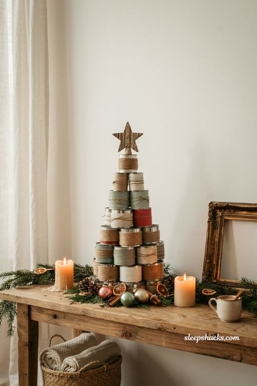 Mini tin can christmas tree with rustic upcycled holiday decor on a farmhouse table