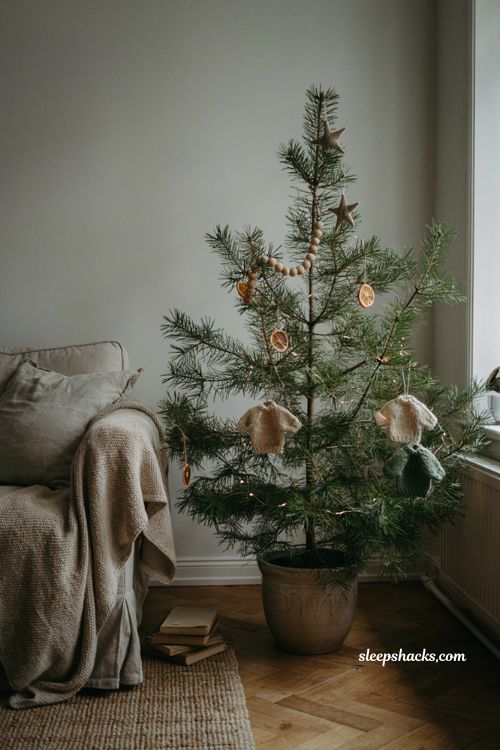 Minimalist Scandinavian Christmas tree ideas simple hygge decor with wooden and ceramic ornaments