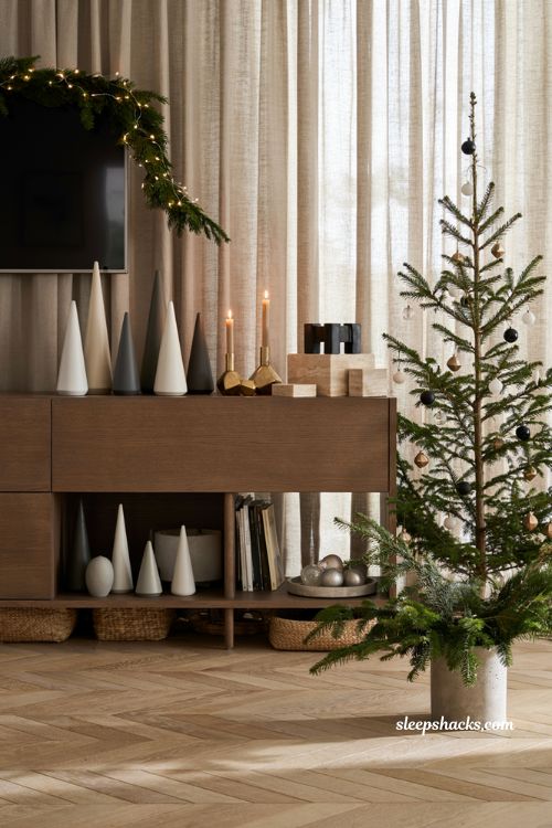 Modern christmas decor ideas for a living room tv stand with geometric holiday styling