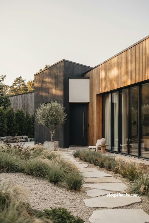 Modern house design ideas with black exterior accents and warm contemporary home design