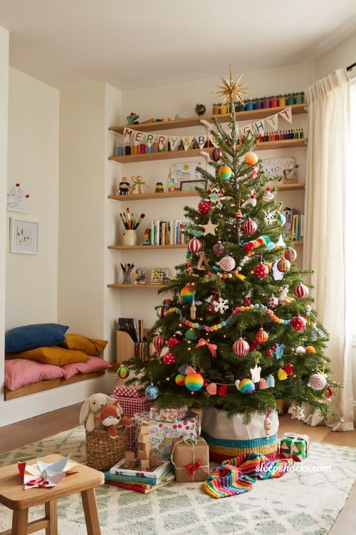 Multi color rainbow Christmas tree with whimsical kids playroom holiday decor ideas