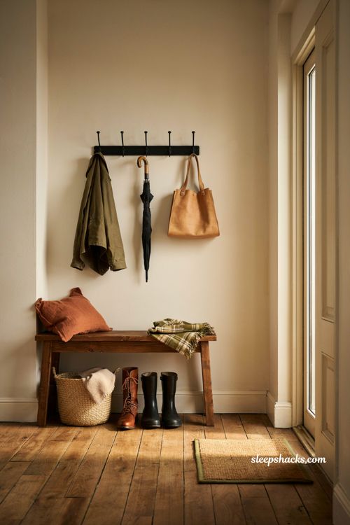 Organized fall entryway bench with shoe baskets and coat rack hooks