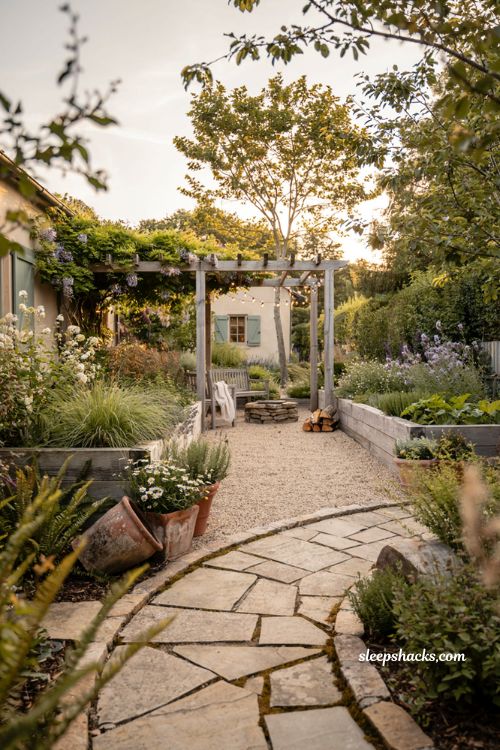Outdoor landscaping ideas with cozy modern cottage backyard design and layered garden beds