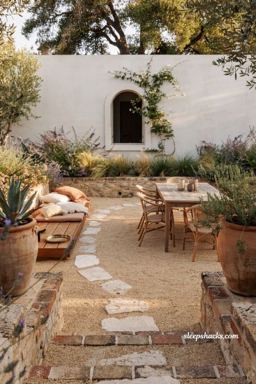 Outdoor landscaping ideas with gravel patio courtyard and drought tolerant modern cottage garden