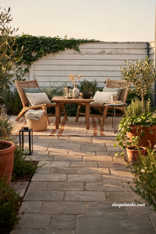 Patio decorating ideas on a budget with wicker wood furniture and layered natural textures