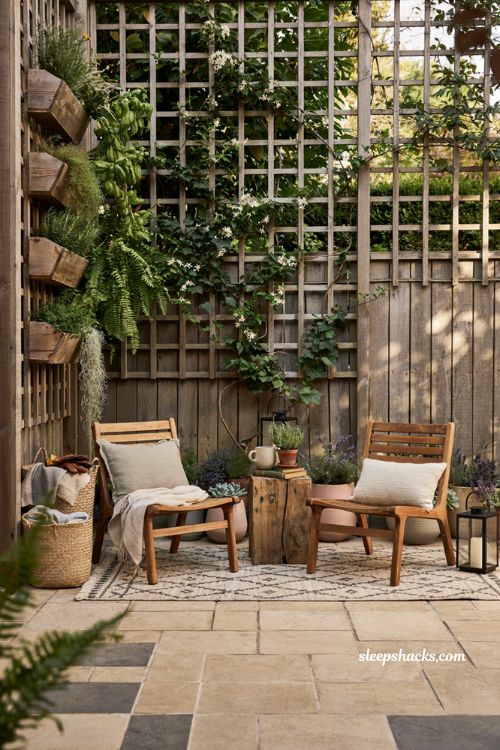 Patio decorating ideas on a budget with wooden trellis and vertical garden for small spaces