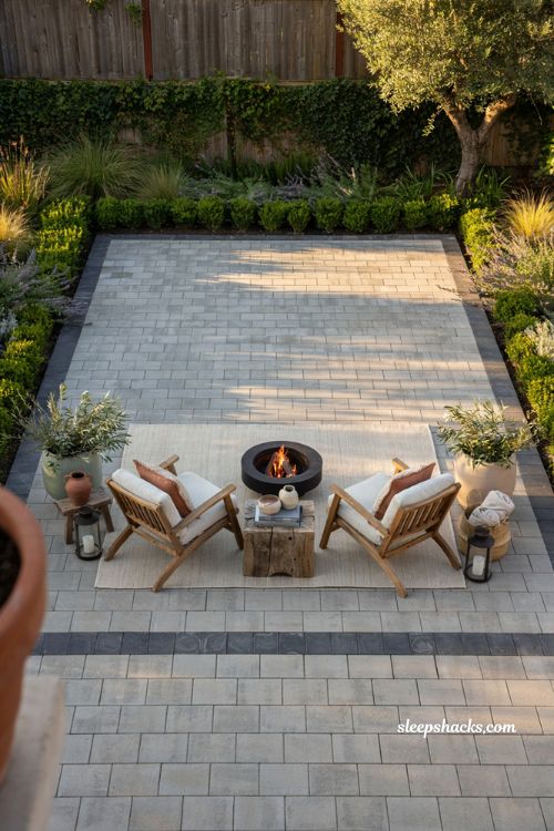 Paver patio ideas on a budget with contrasting charcoal border and modern outdoor seating