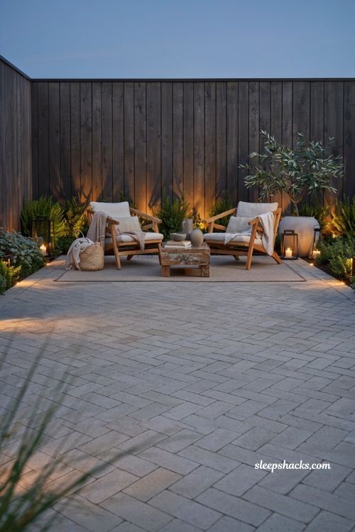Paver patio ideas on a budget with warm landscape lighting and clean paver joints