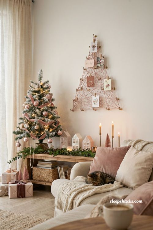 Pink christmas string art card display in a cozy living room with blush holiday decor