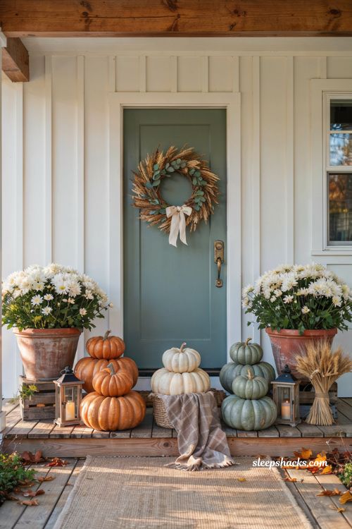 Pumpkin porch decor with a cohesive orange cream and sage pumpkin palette