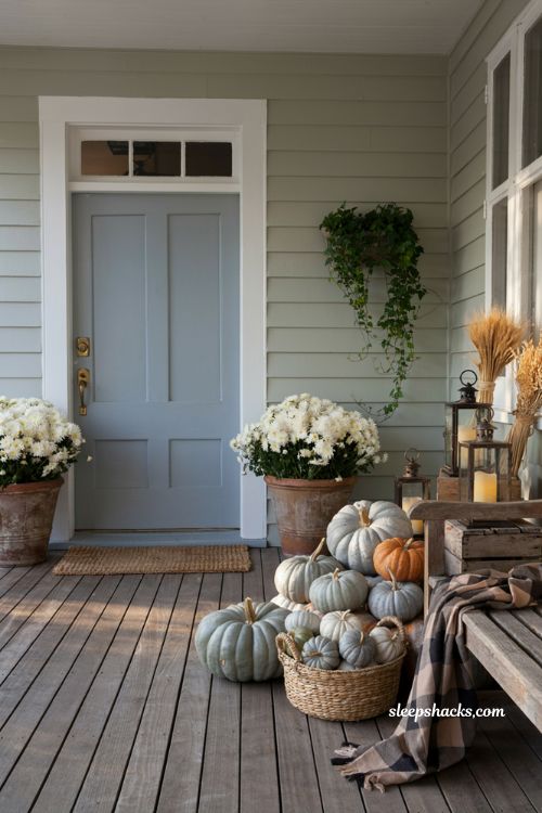 Pumpkin porch decor with beautifully painted farmhouse pumpkins for fall