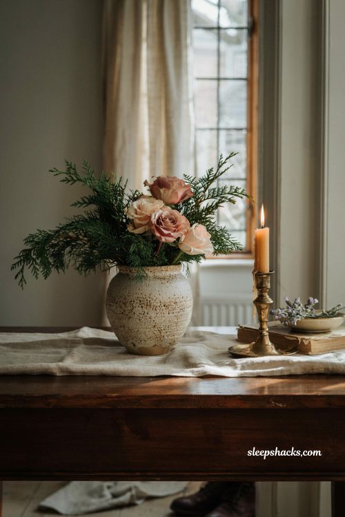 Simple and elegant DIY Christmas flower arrangement with fresh cedar and roses for holiday decor