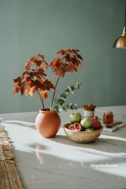 Simple fall kitchen island decor with maple stems and fruit bowl
