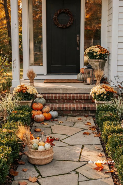 Simple fall porch decorating ideas extending pumpkins mums and autumn decor into the front yard