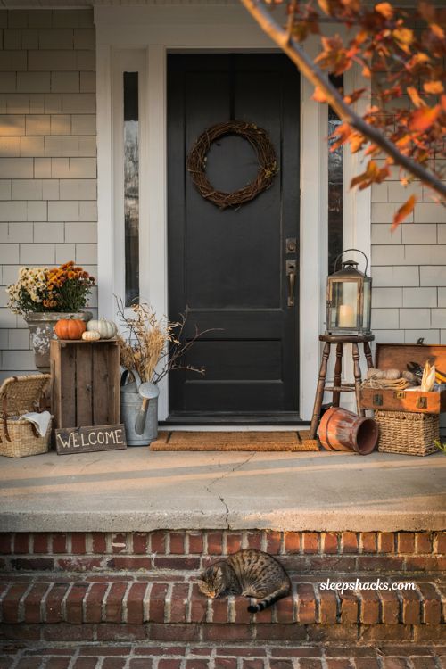 Simple fall porch decorating ideas using vintage crates baskets planters and cosy farmhouse autumn styling
