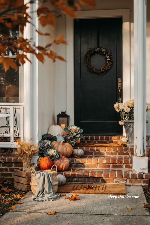 Simple fall porch decorating ideas with ornamental kale pumpkins and cosy farmhouse autumn steps