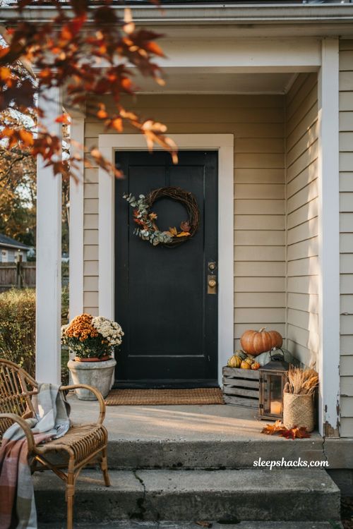 Simple fall porch decorating ideas with pumpkins mums lantern and cosy farmhouse front entry