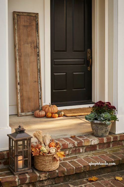 Small front porch fall decor ideas with rustic wooden welcome sign pumpkins and cosy farmhouse autumn styling