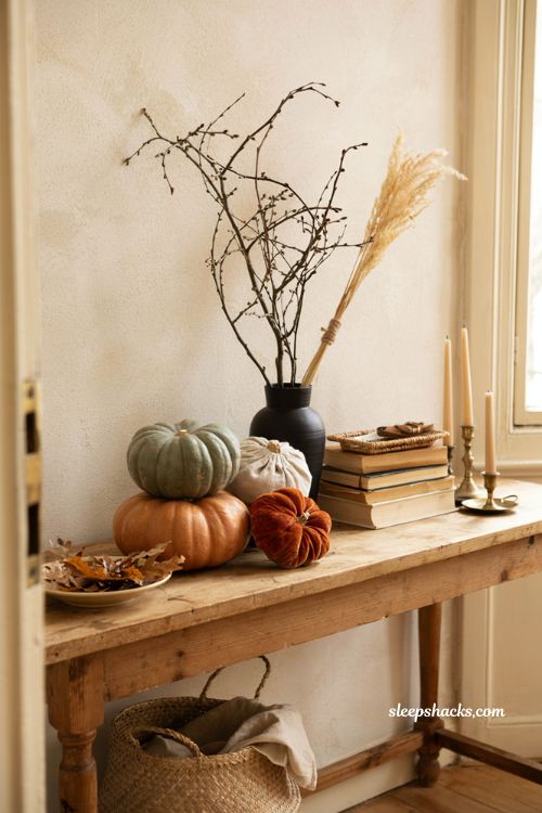 Stacked pumpkin halloween decor with cosy autumn entryway styling ideas