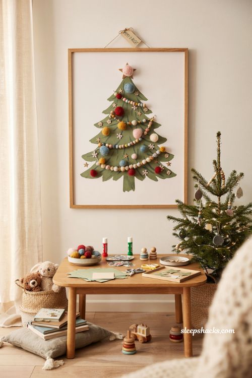 Sticker and pom pom Christmas tree craft for toddlers with cozy nursery holiday decor ideas