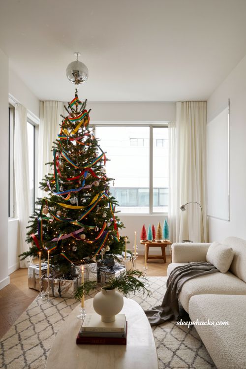 Themed christmas tree ideas with a rainbow disco ball christmas tree in a colorful modern living room