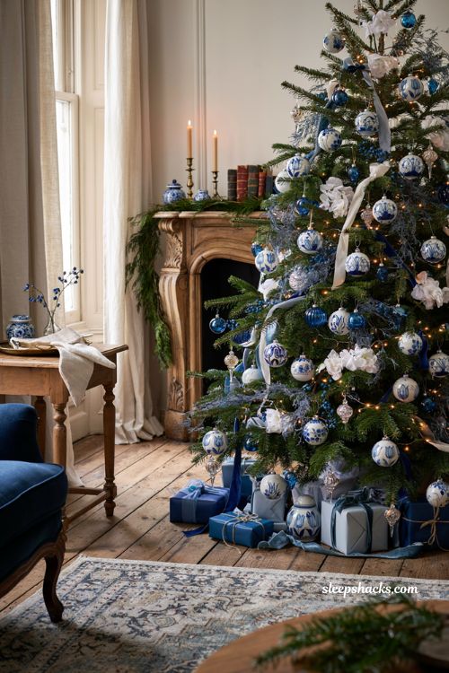 Themed christmas tree ideas with blue and white delft inspired ornaments and elegant holiday decor