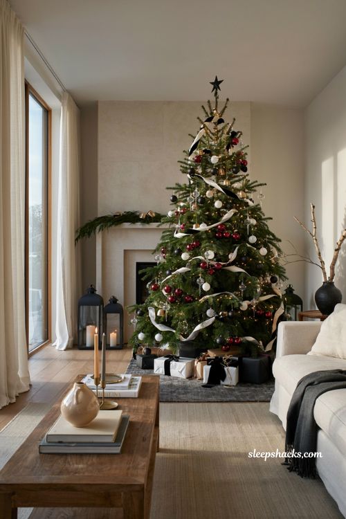 Themed christmas tree ideas with bold black white and red holiday decor in a modern living room