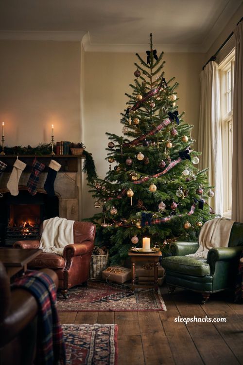 Timeless christmas decor with cozy plaid christmas tree and classic fireplace living room