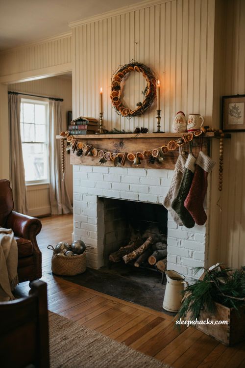 Vintage christmas decor diy with dried orange garland on a farmhouse mantel