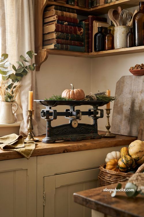 Vintage fall decor ideas with an antique cast iron kitchen scale on a cozy farmhouse counter