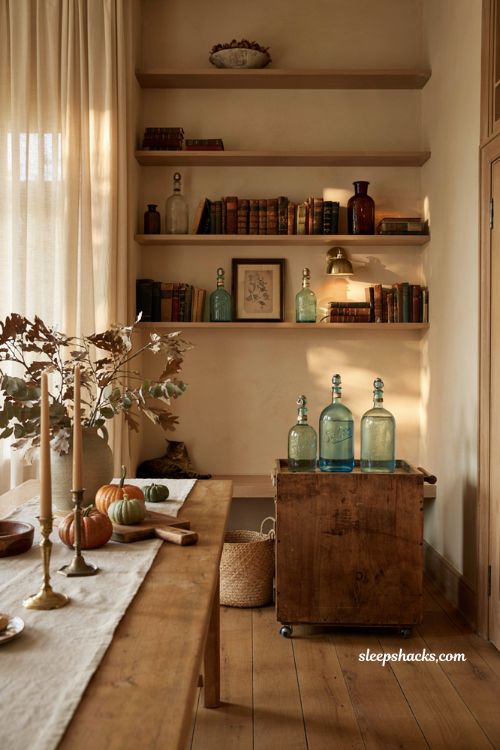 Vintage fall decor ideas with antique glass seltzer bottles styled on a farmhouse bar cart