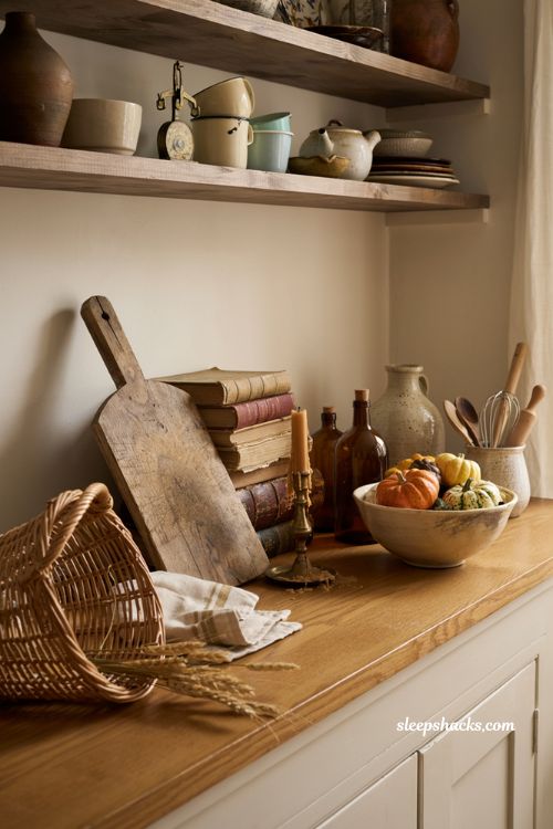 Vintage fall decor ideas with rustic wooden bread board styling in a cozy farmhouse kitchen