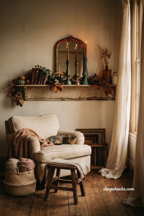 Vintage fall decor ideas with tarnished brass and copper candlesticks on a cozy autumn mantel