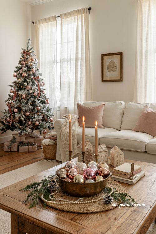 Vintage pink christmas ornaments in a brass bowl on a cozy living room coffee table