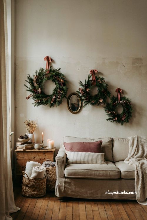 christmas wreath gallery wall ideas with mirrors and greenery for a cozy living room