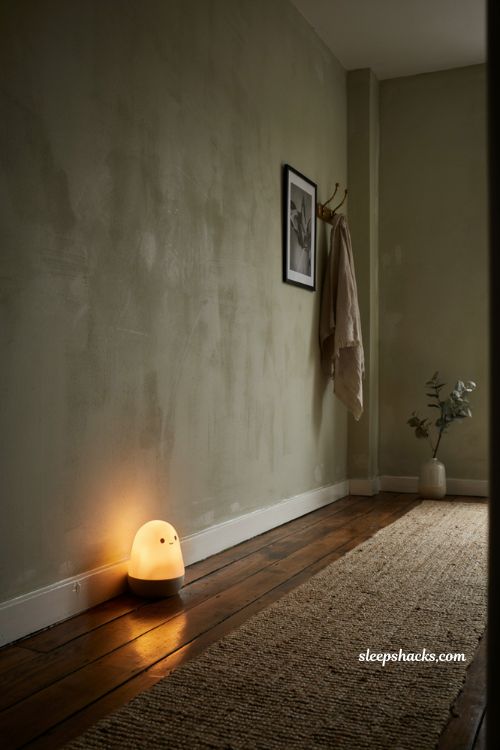 matte ceramic ghost night light glowing softly in a dim hallway for ambient halloween decor